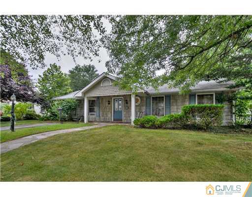100 Winthrop Road Edison, NJ 08817 - Photo 2 of 18 a front view of a house with a yard and trees