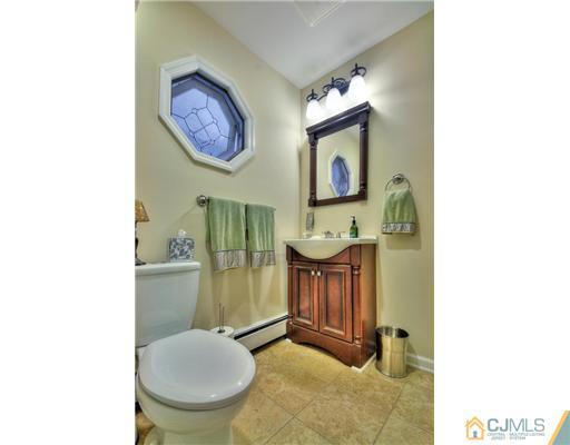 100 Winthrop Road Edison, NJ 08817 - Photo 13 of 18 a bathroom with a toilet and a mirror