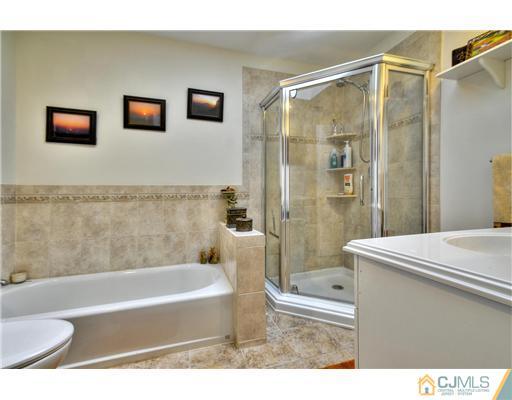 100 Winthrop Road Edison, NJ 08817 - Photo 15 of 18 a bathroom with a bathtub and a shower