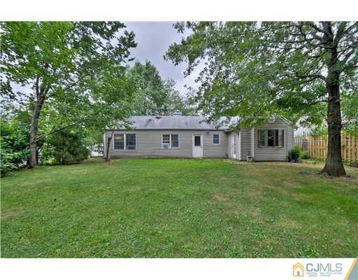 100 Winthrop Road Edison, NJ 08817 - Photo 16 of 18 a front view of a house with a garden