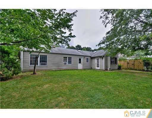 100 Winthrop Road Edison, NJ 08817 - Photo 17 of 18 a view of a house with a backyard