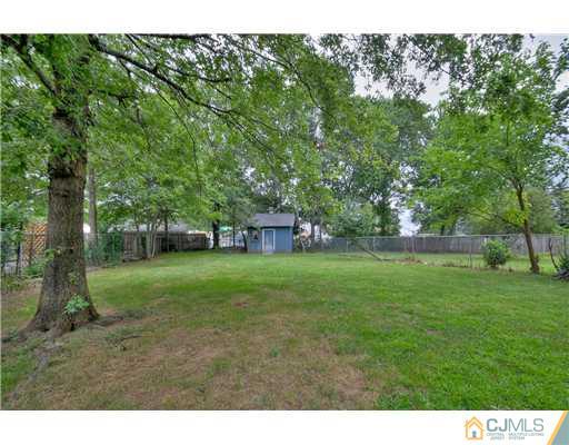 100 Winthrop Road Edison, NJ 08817 - Photo 18 of 18 a view of a big yard with a house