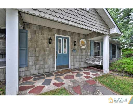 100 Winthrop Road Edison, NJ 08817 - Photo 3 of 18 a front view of a house with garden