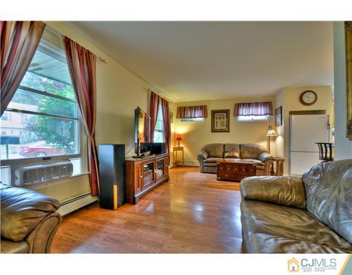 100 Winthrop Road Edison, NJ 08817 - Photo 5 of 18 a living room with furniture and a flat screen tv