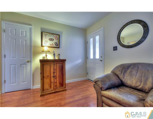100 Winthrop Road Edison, NJ 08817 - Photo 6 of 18 a living room with furniture and a window
