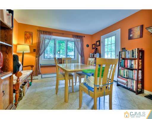 100 Winthrop Road Edison, NJ 08817 - Photo 10 of 18 a view of a dining room with furniture window and wooden floor