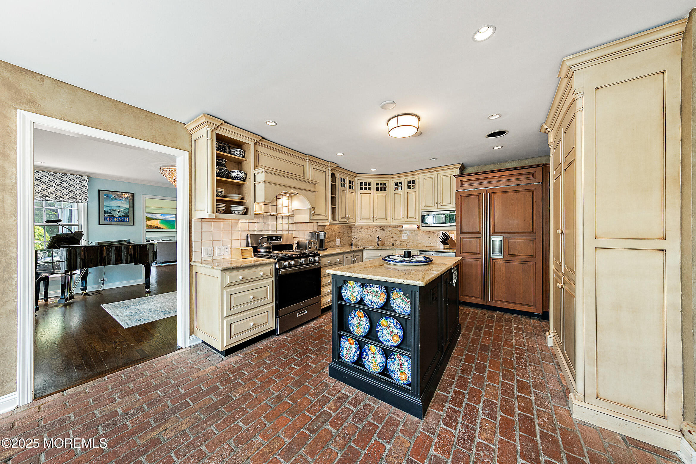 45 Wardell Avenue Rumson, NJ 07760 - Photo 11 of 57 a kitchen with stainless steel appliances granite countertop a refrigerator a stove a sink and a dining table with wooden floor
