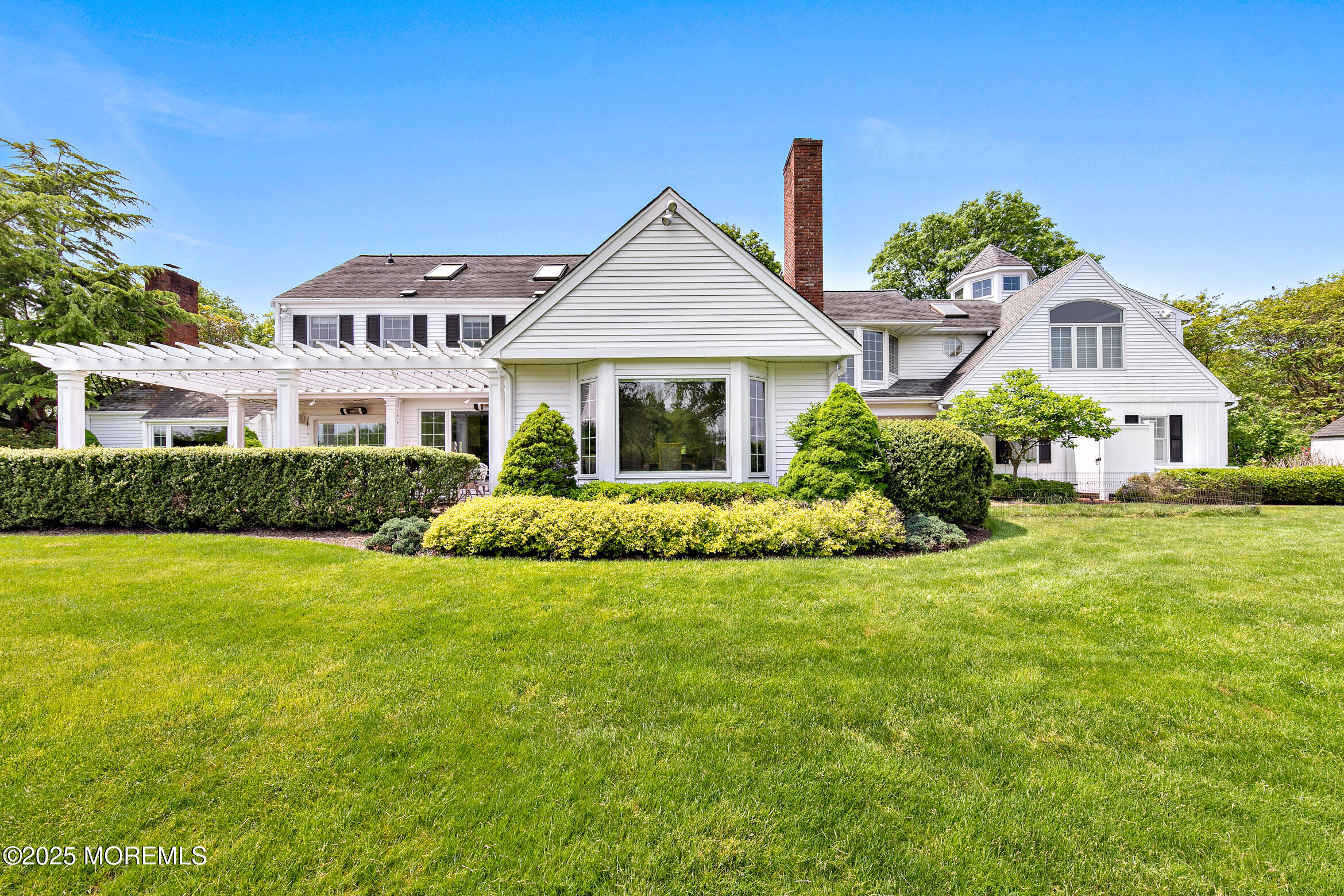 45 Wardell Avenue Rumson, NJ 07760 - Photo 38 of 57 a front view of a house with garden