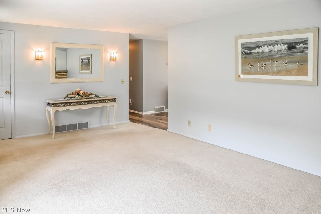 4877 4th Street Northwest Canton, OH 44708 - Photo 3 of 24 The living room offers newer carpet.