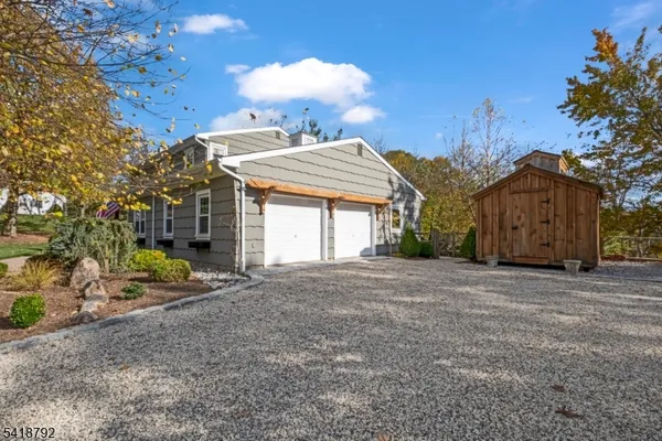 a view of a lake with a house in the background