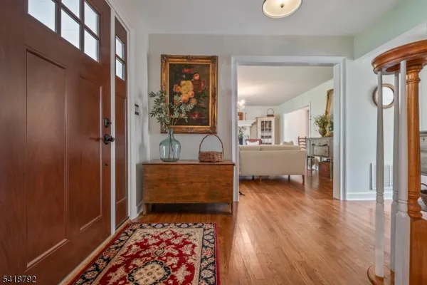 a living room with furniture fireplace and a large window
