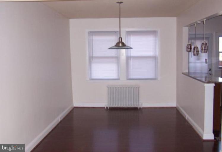 922 North Hill Road Baltimore, MD 21218 - Photo 2 of 14 a room with a window and wooden floor