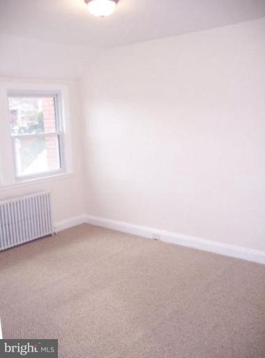 922 North Hill Road Baltimore, MD 21218 - Photo 11 of 14 an empty room with a window