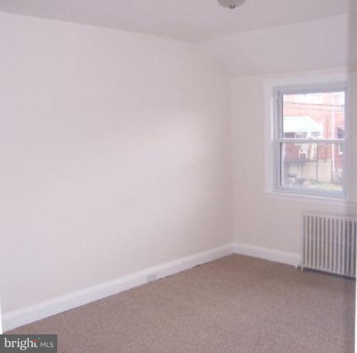 922 North Hill Road Baltimore, MD 21218 - Photo 12 of 14 an empty room with a window