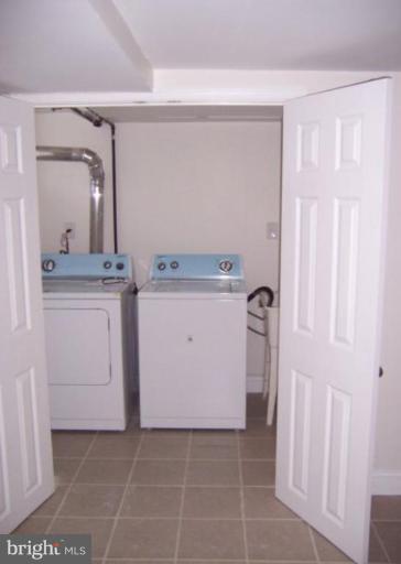 922 North Hill Road Baltimore, MD 21218 - Photo 9 of 14 a view of a storage and utility room with washer dryer