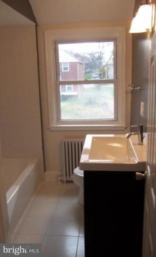 922 North Hill Road Baltimore, MD 21218 - Photo 10 of 14 a bathroom with a sink and a bathtub