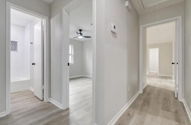 wooden floor with white walls