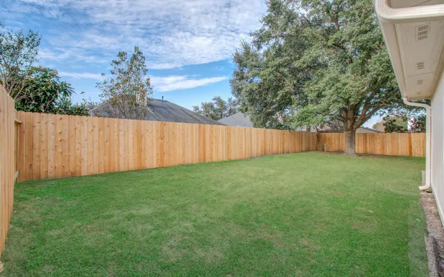 a view of backyard with green space
