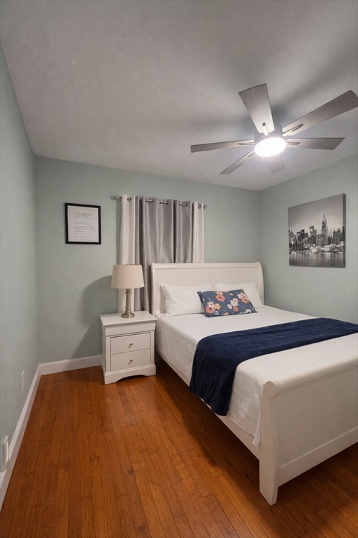 178 Cohasset Street, Unit 1 Worcester, MA 01604 - Photo 5 of 7 a spacious bedroom with a bed and a couch