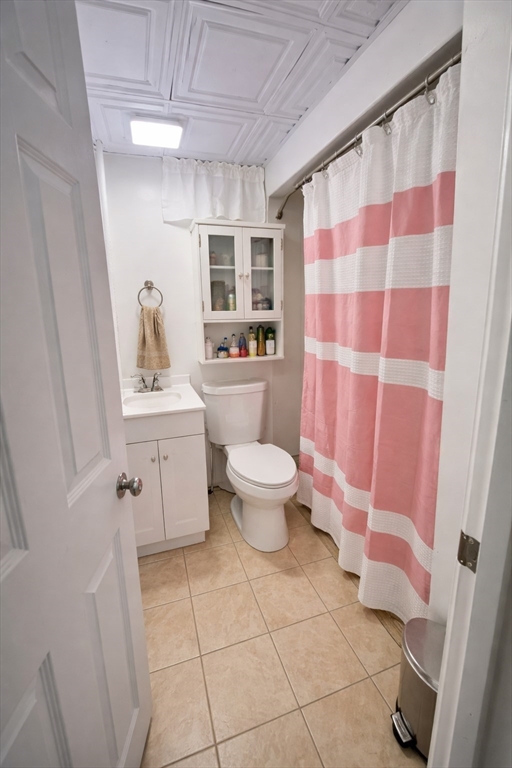 178 Cohasset Street, Unit 1 Worcester, MA 01604 - Photo 6 of 7 a bathroom with a sink toilet and shower