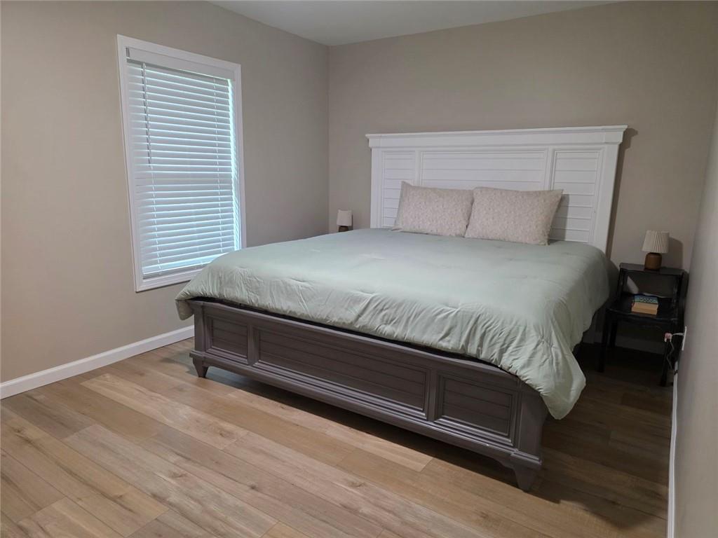 722 Lacy Street Monroe, GA 30655 - Photo 11 of 19 a bedroom with a bed and a window