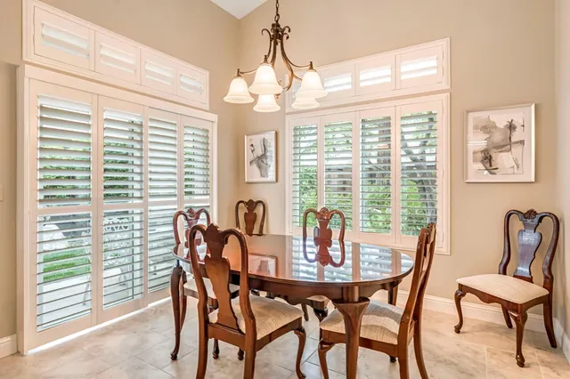 a dining room with furniture and window