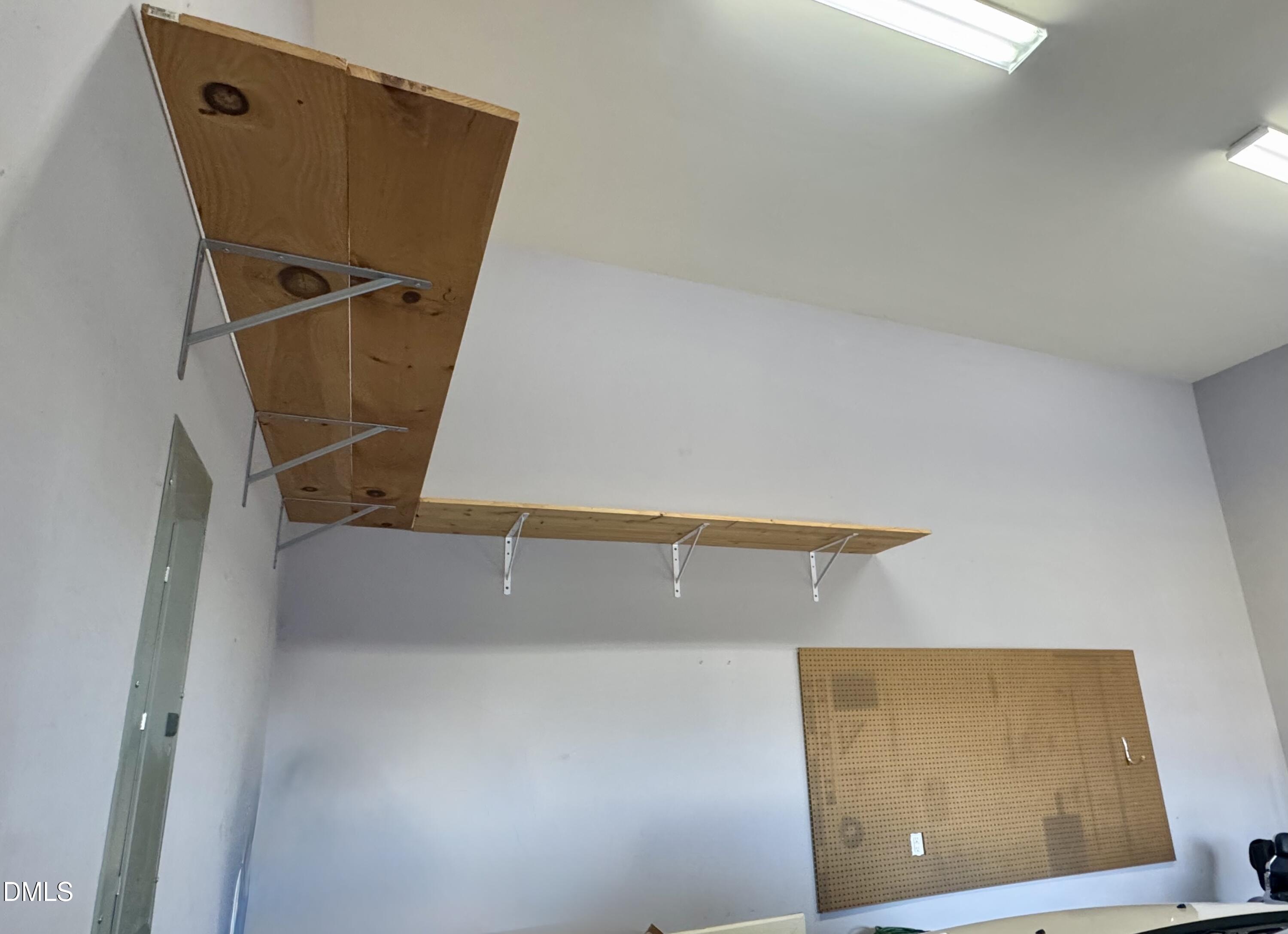 136 Kenneth Lane Willow Spring, NC 27592 - Photo 54 of 94 shelving and pegboard