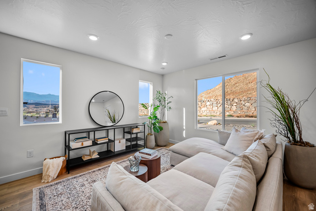 2202 Wolverine Way, Unit 2529 Washington, UT 84780 - Photo 4 of 27 Bright living area featuring wood-finish flooring and recessed lighting