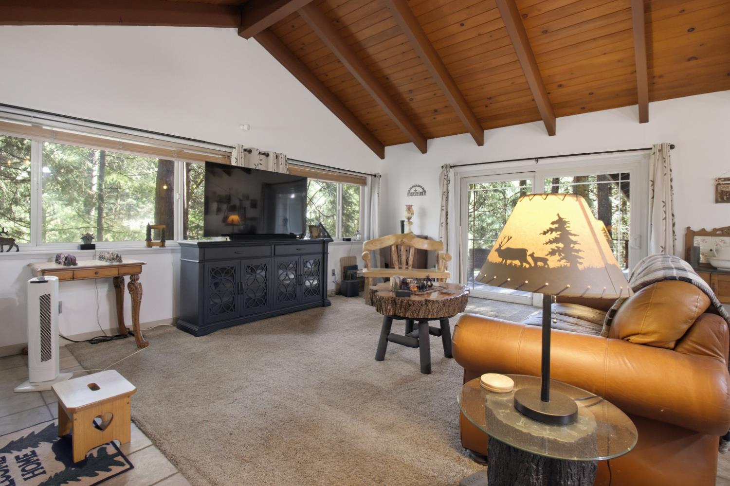 4599 Rivendale Road Placerville, CA 95667 - Photo 2 of 27 a living room with furniture a window and a flat screen tv