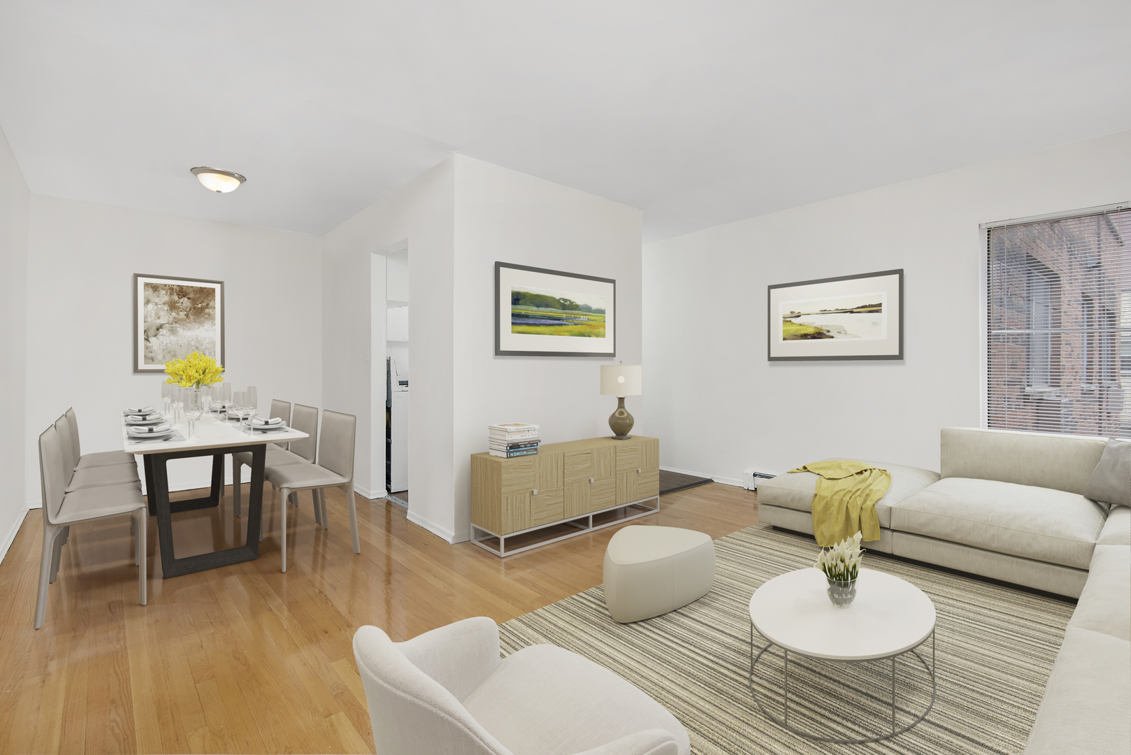 450 West Melrose Street, Unit 239 Chicago, IL 60657 - Photo 3 of 10 a living room with furniture and a dining table with wooden floor