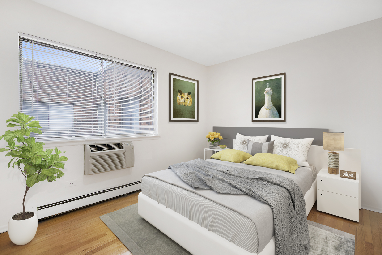 450 West Melrose Street, Unit 239 Chicago, IL 60657 - Photo 9 of 10 a bedroom with a bed and a potted plant