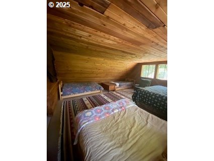 64 Northwoods Cougar, WA 98616 - Photo 7 of 22 a bedroom with a bed and a window