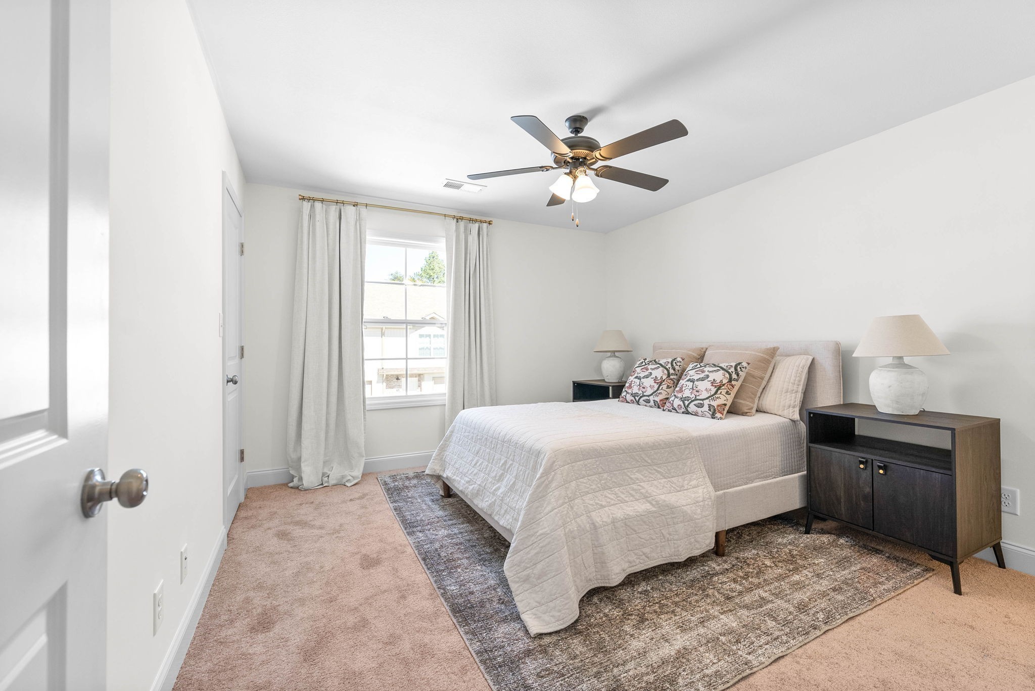 940 Britton Springs Road, Unit 403 Clarksville, TN 37042 - Photo 11 of 15 a bedroom with a large bed and a chandelier