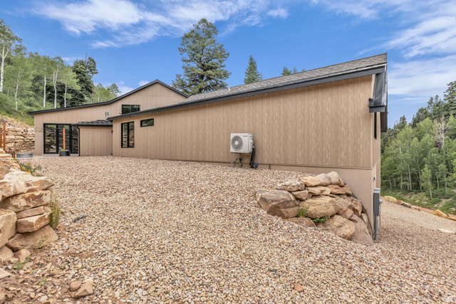 1766 West Tollgate Cyn Road Coalville, UT 84017 - Photo 41 of 59 Modern architecture with light tan vertical siding and black trim windows