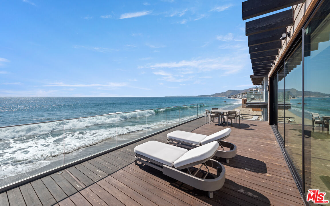 24604 Malibu Road Malibu, CA 90265 - Photo 5 of 17 a view of a terrace with wooden floor and ocean view