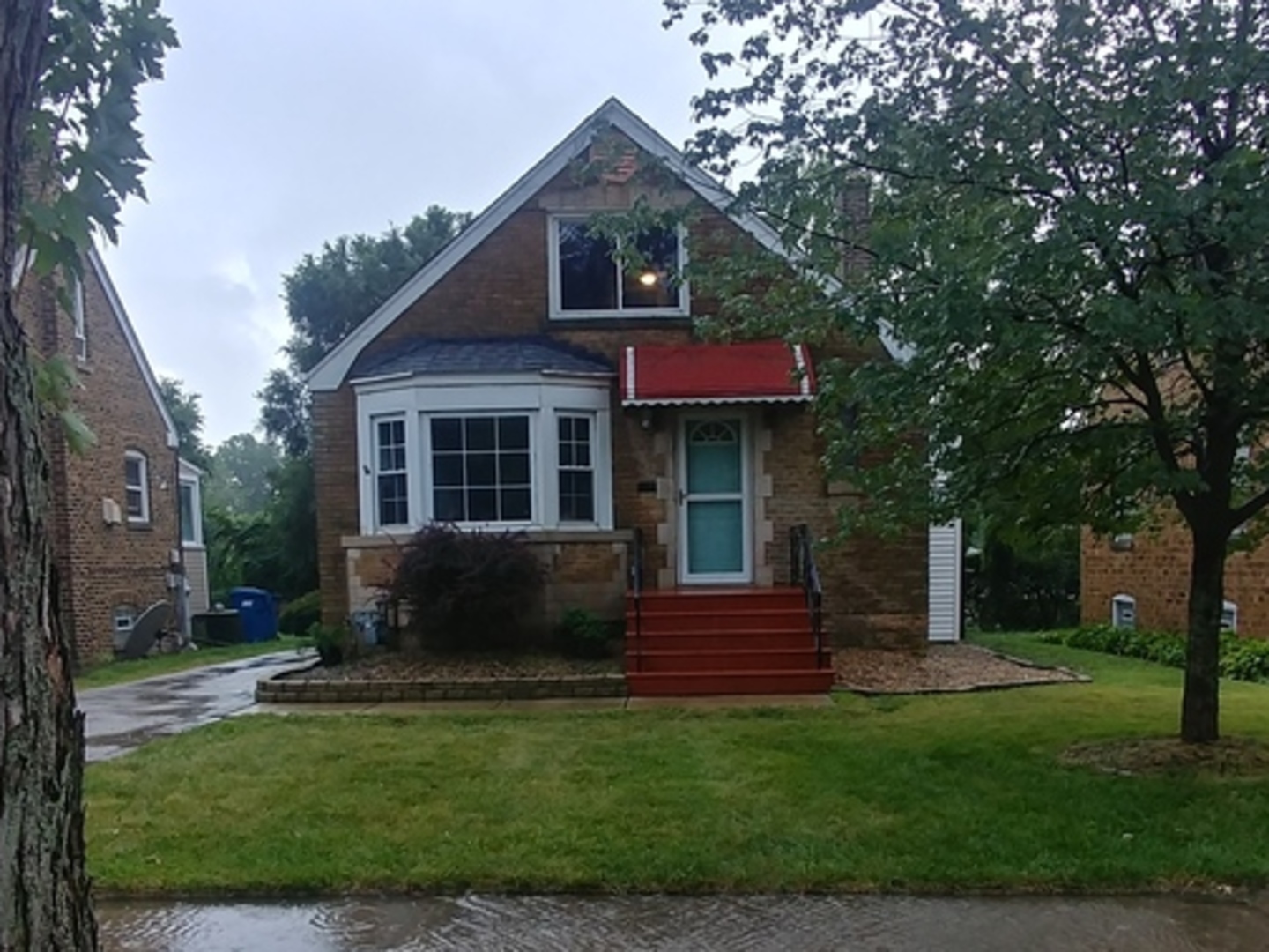 202 7th Place Chicago Heights, IL 60411 - Photo 1 of 11 a front view of a house with a yard