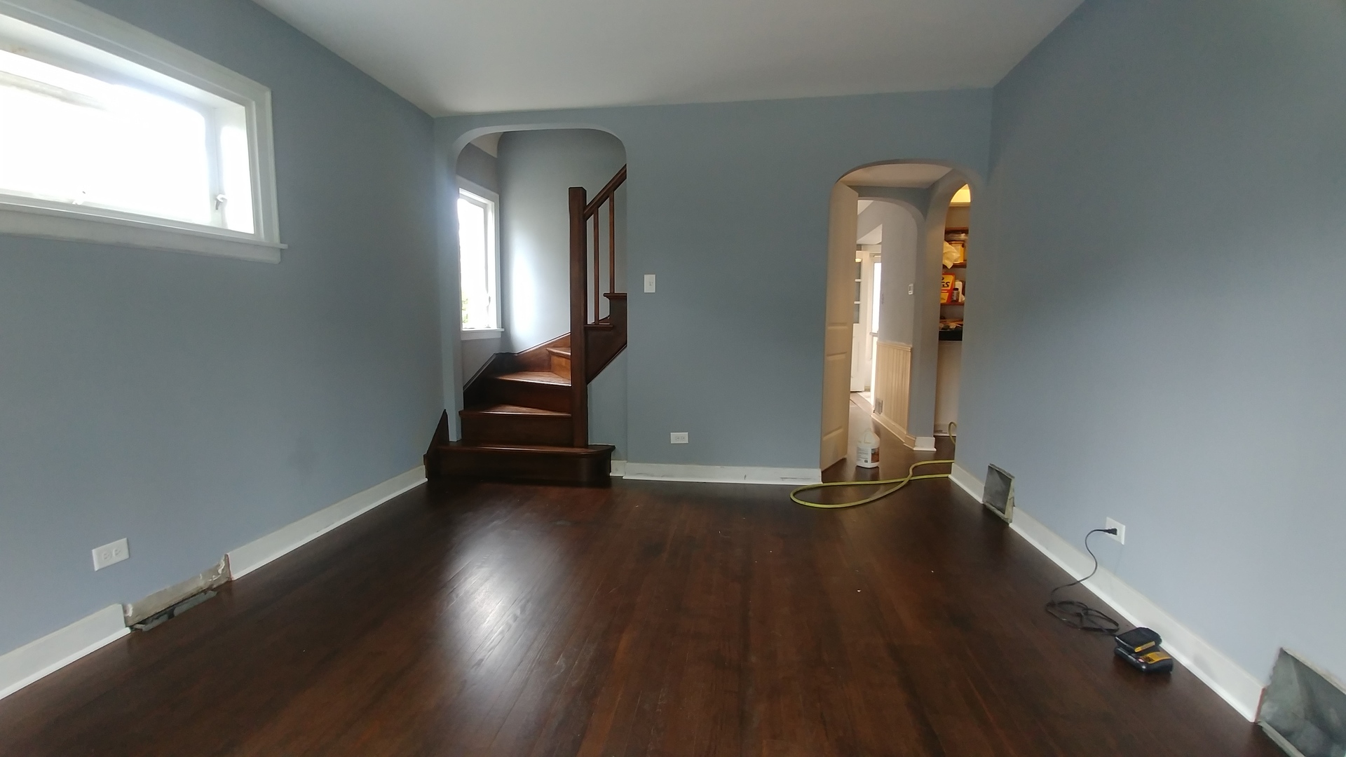 202 7th Place Chicago Heights, IL 60411 - Photo 2 of 11 an empty room with wooden floor and windows