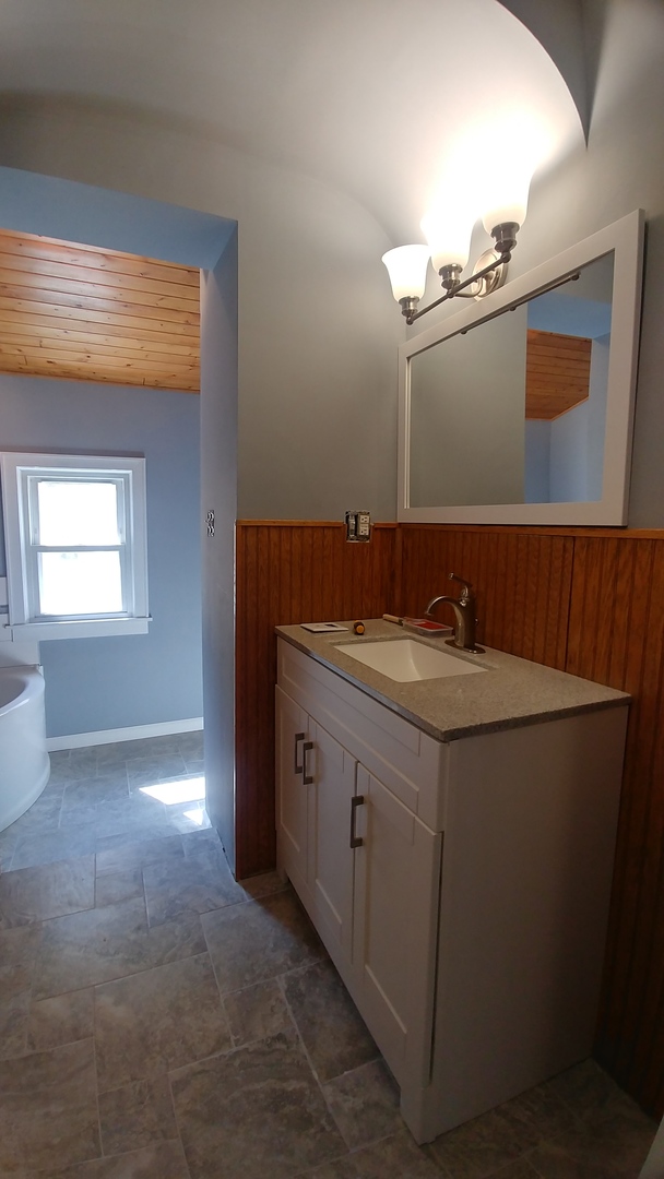 202 7th Place Chicago Heights, IL 60411 - Photo 7 of 11 a bathroom with a sink and a mirror