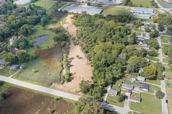 an aerial view of a house with a yard