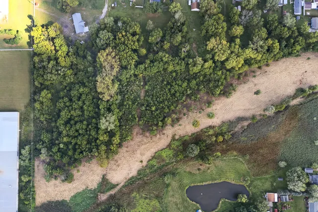 a backyard of a house with a yard with outdoor seating