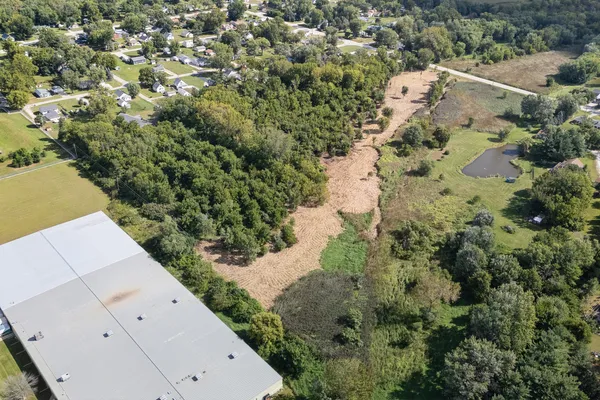 an aerial view of house with yard