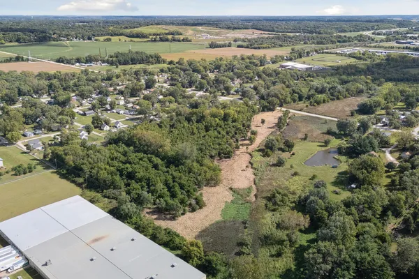 an aerial view of residential houses with outdoor space