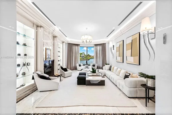 a living room with furniture or couches and a chandelier