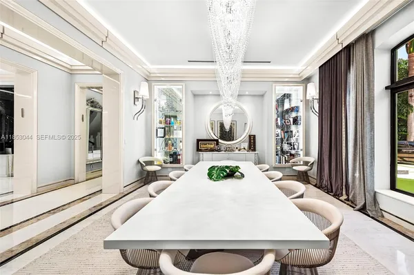 a view of a hallway with wooden floor and windows