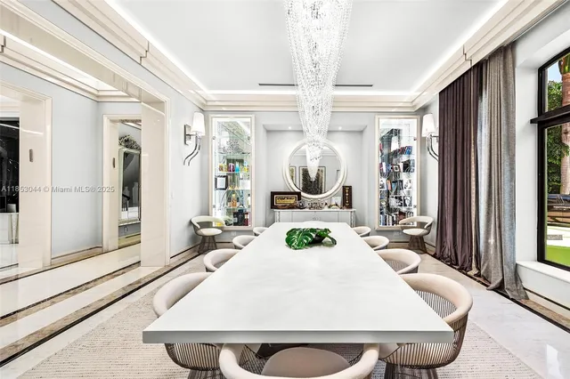 a view of a hallway with wooden floor and windows