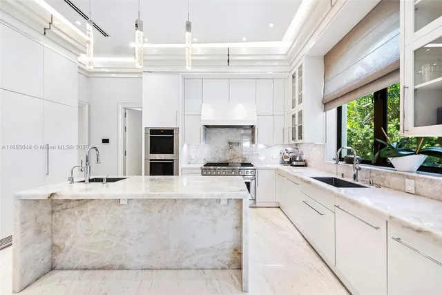 a bedroom with a large bed and a potted plant