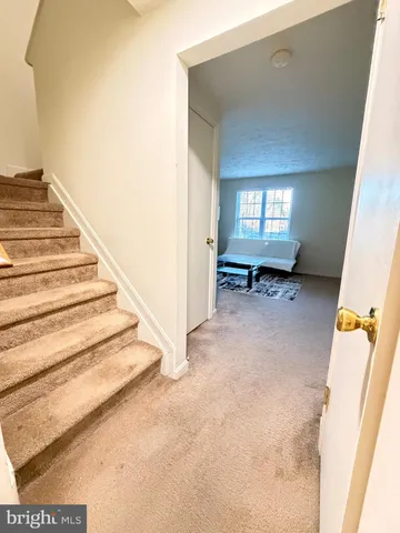 a view of an entryway with stairs