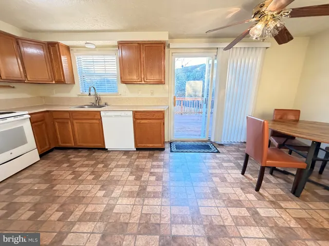 a kitchen with a sink cabinets and window
