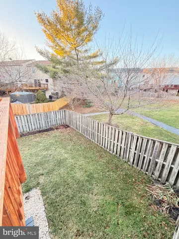 a view of balcony with wooden fence