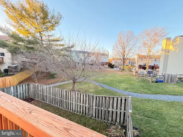 a view of a deck with a backyard